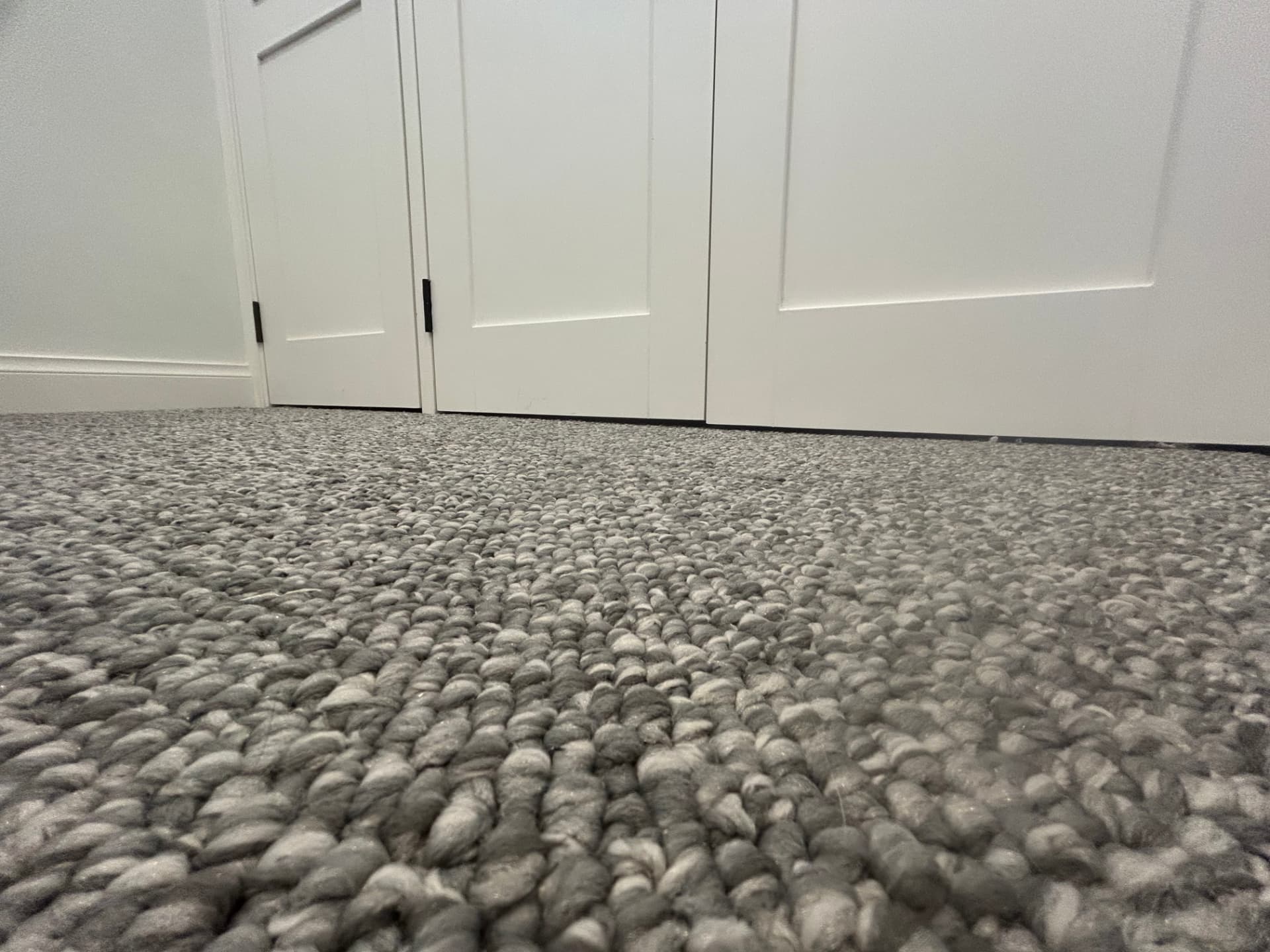Clearance gap between door bottom and new carpet pile after trimming, Seddon