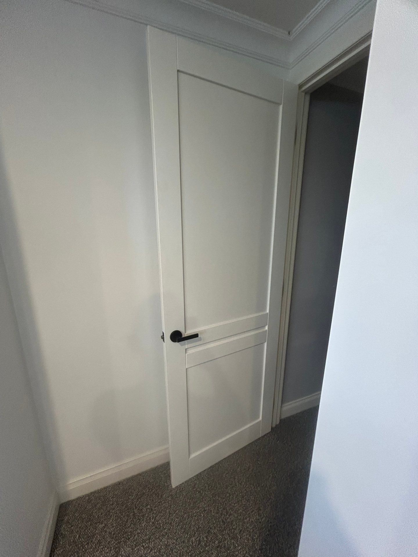 Close-up of door finish after trimming and re-hanging in Seddon