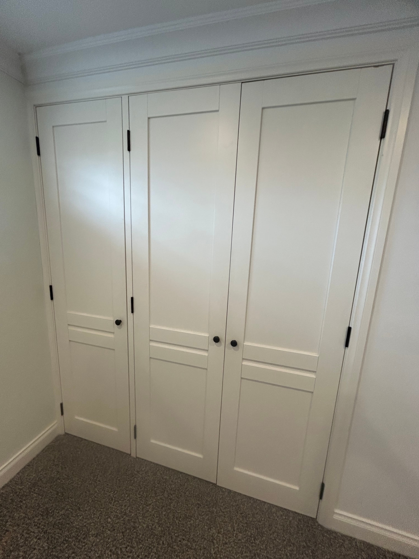 Hallway doors re-hung after being trimmed to clear new carpet in Seddon